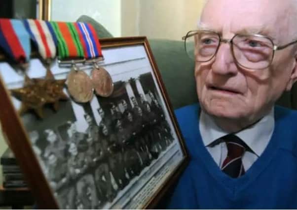 Gordon Horsewood, 96 year-old Normandy veteran died on April 30, pictured in 2012 with a photograph of his WW2 comrades.