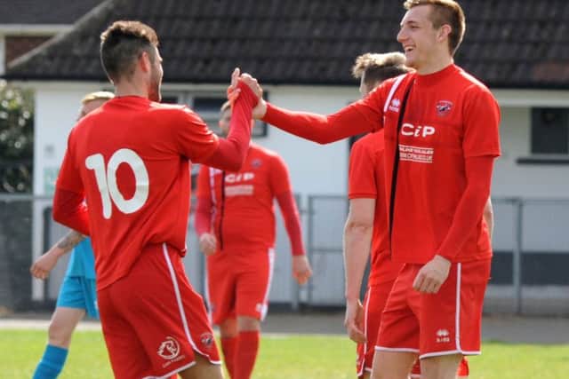 Action from AFC Mansfield versus Clipstone as Phil Buxton, (10) congratulates Ollie Fearon on his goal.