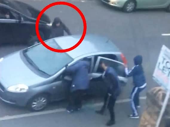 A group of men surrounded the car and began attacking Aqib and his friend.