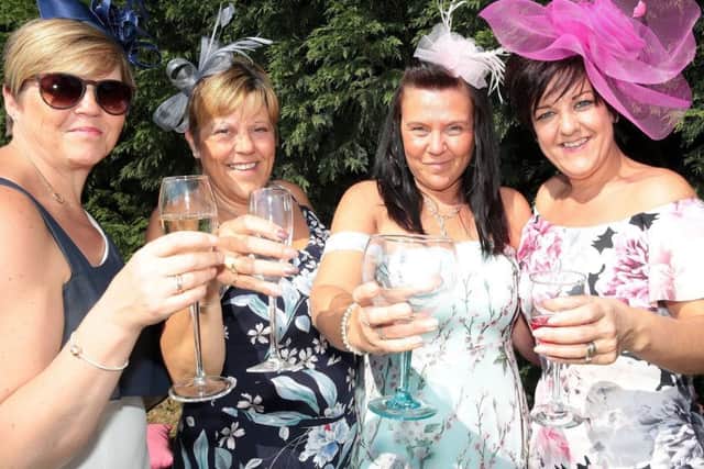 Helen, Lesley, Sally and Hayley raise a glass to the royal couple, Sutton-in-Ashfield, United Kingdom, 19th May 2018. Photo by Glenn Ashley.