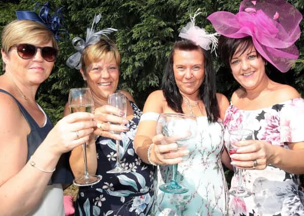 Helen, Lesley, Sally and Hayley raise a glass to the royal couple, Sutton-in-Ashfield, United Kingdom, 19th May 2018. Photo by Glenn Ashley.