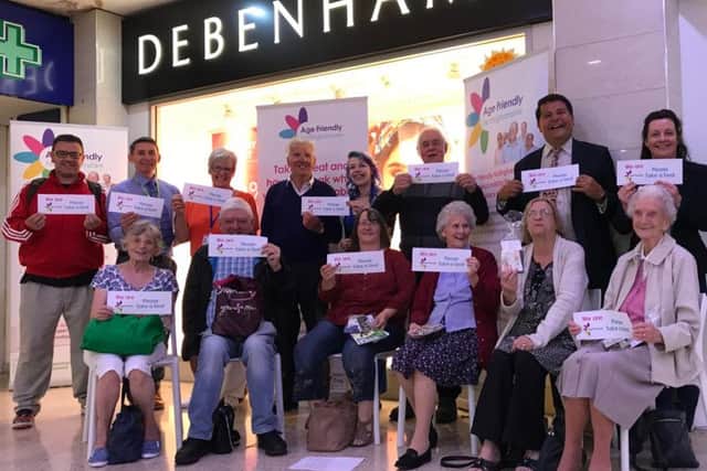 Councillor Gordon Wheeler (back row, second right) joined Debenhams staff and customers to launch the Take a Seat campaign in Mansfield town centre.