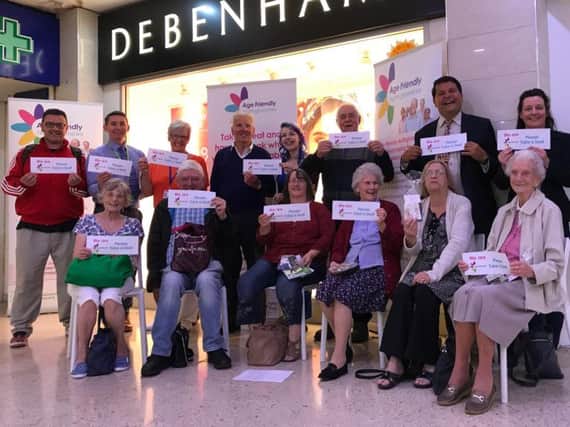 Councillor Gordon Wheeler (back row, second right) joined Debenhams staff and customers to launch the Take a Seat campaign in Mansfield town centre.
