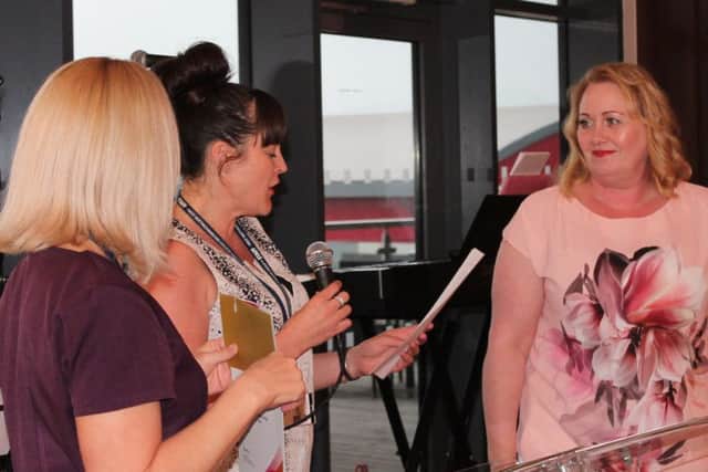 Beauty student Karen Alrighton receives her Mentor of the Year Award