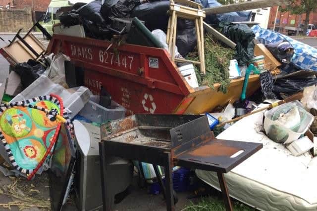 Huthwaite Library site, skip under rubbish. By Cathy Mason