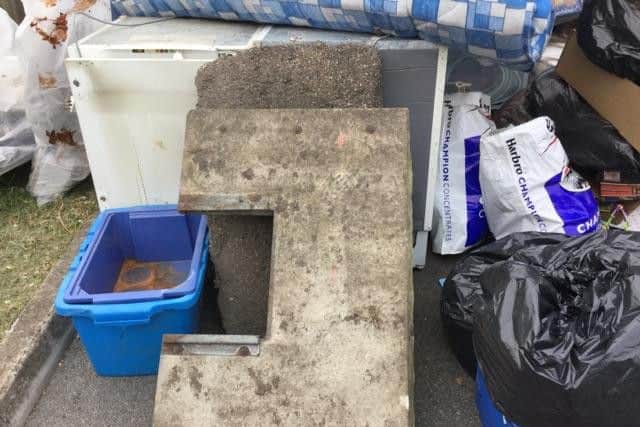 Huthwaite Library site, skip under rubbish. By Cathy Mason