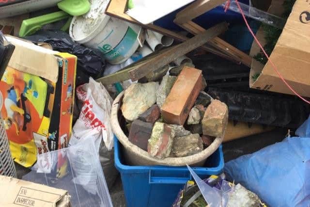 Huthwaite Library site, skip under rubbish. By Cathy Mason