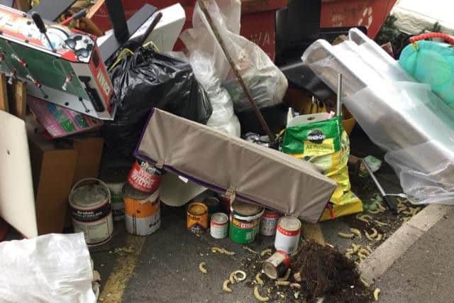 Huthwaite Library site, skip under rubbish. By Cathy Mason