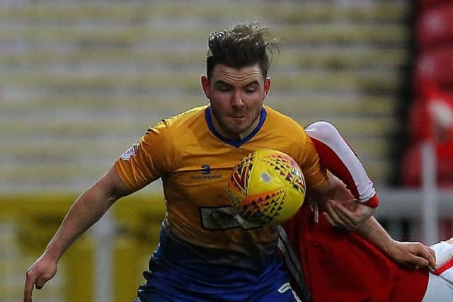 Picture by Gareth Williams/AHPIX.com; Football; Sky Bet League Two; Swindon Town v Mansfield Town; 10/2/18 KO 15.00; The Energy Check County Ground; copyright picture; Howard Roe/AHPIX.com; Mansfield's Alex MacDonald outmuscles Swindon's Paul Mullin