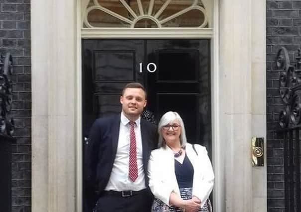 Teaching assistant Sue Cooper outside number 10 Downing Street with Mansfield's MP, Ben Bradley.