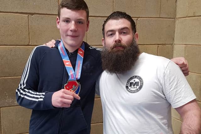 Andrew Johncock, who has been nominated for a 4Uth Award, and his trainer, Shane Mills.