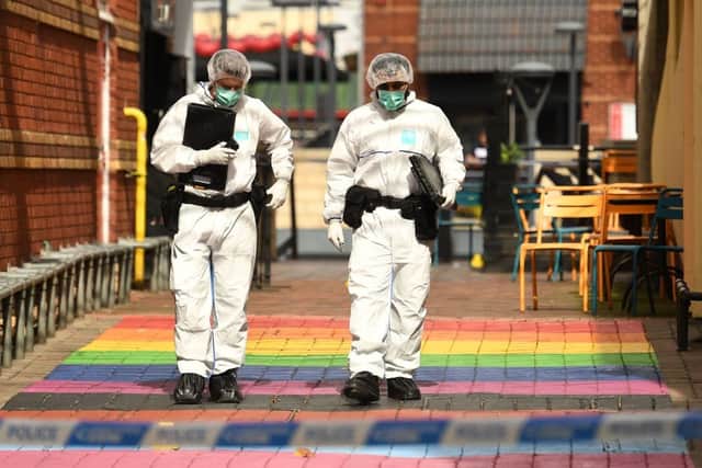 Police forensics officers gather evidence on Hurst Walk, (Getty Images)