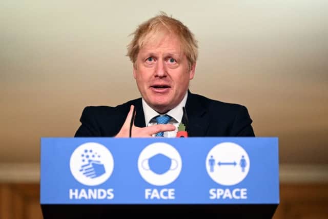 Putting off winter lockdown caused around 25k excess UK Covid deaths - according to a new report (Photo by LEON NEAL/POOL/AFP via Getty Images)
